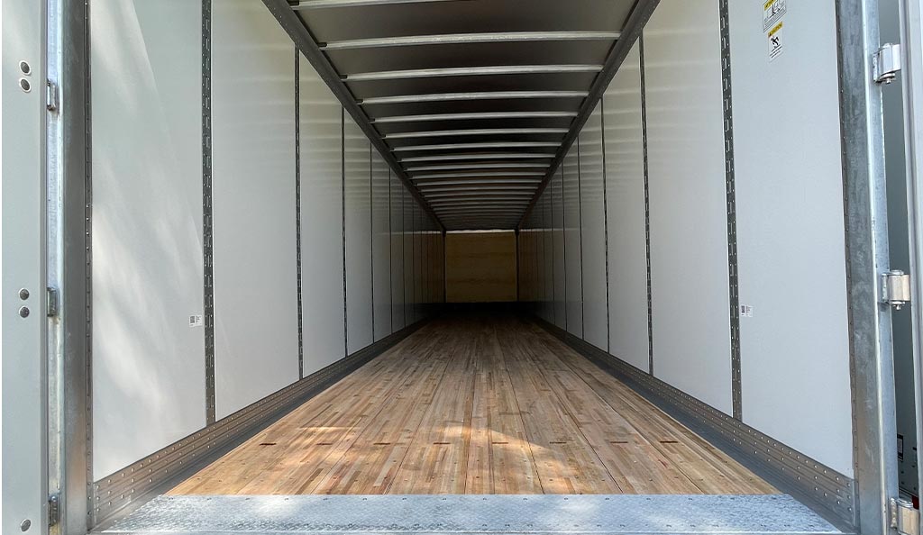 The inside of an empty semi-trailer.