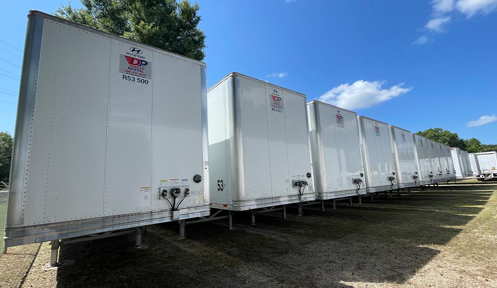 a lineup of several DP semi-trailers