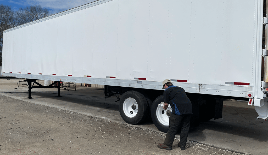 man doing trailer safety inspection